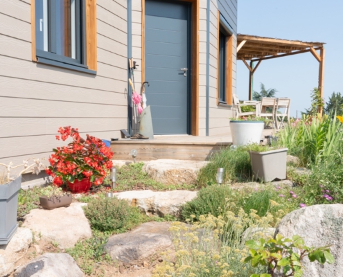 Maison ossature bois avec finition en bardage fibrociment