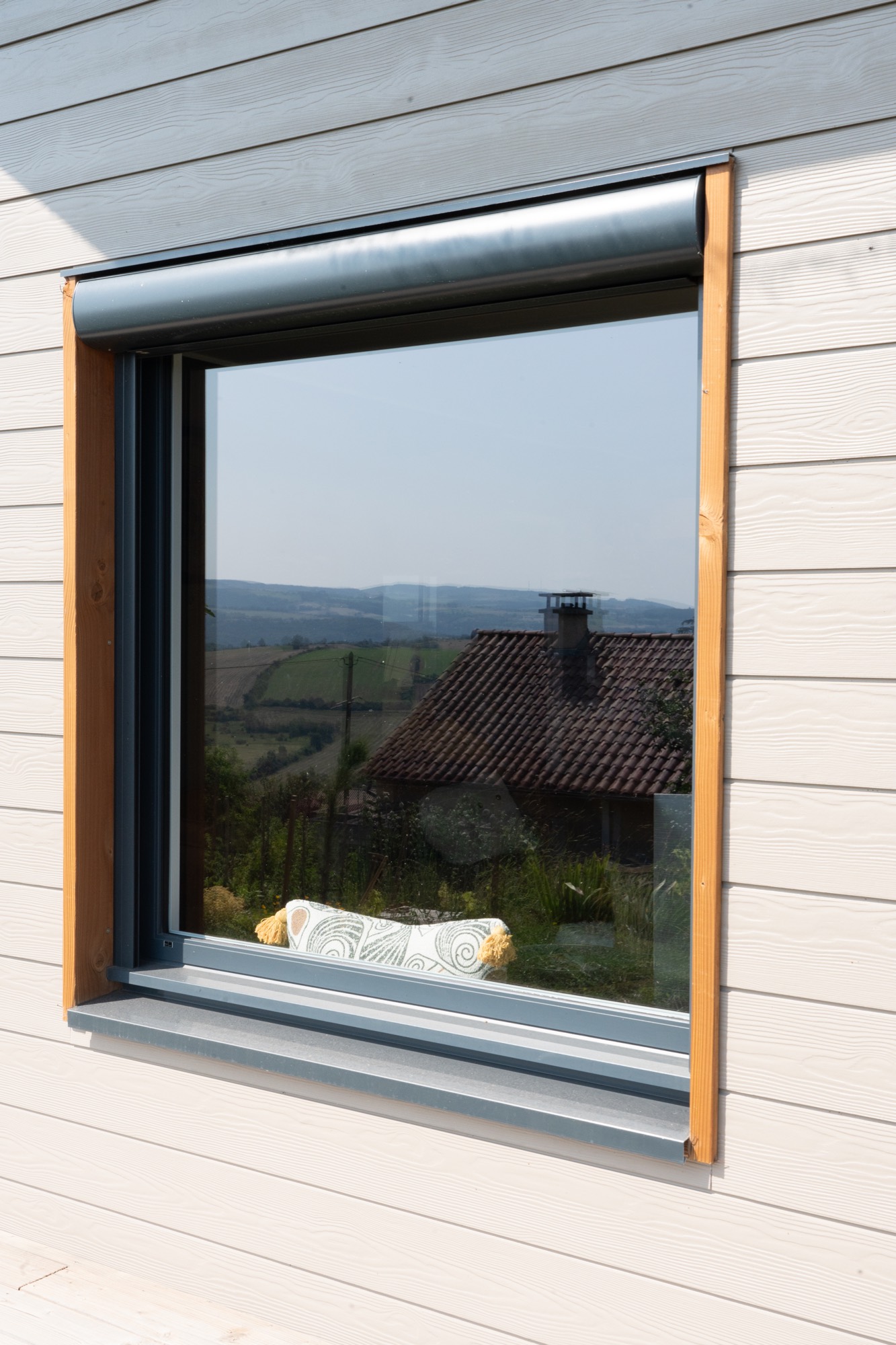Maison ossature bois avec finition en bardage fibrociment