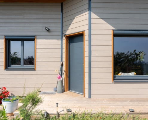 Maison ossature bois avec finition en bardage fibrociment